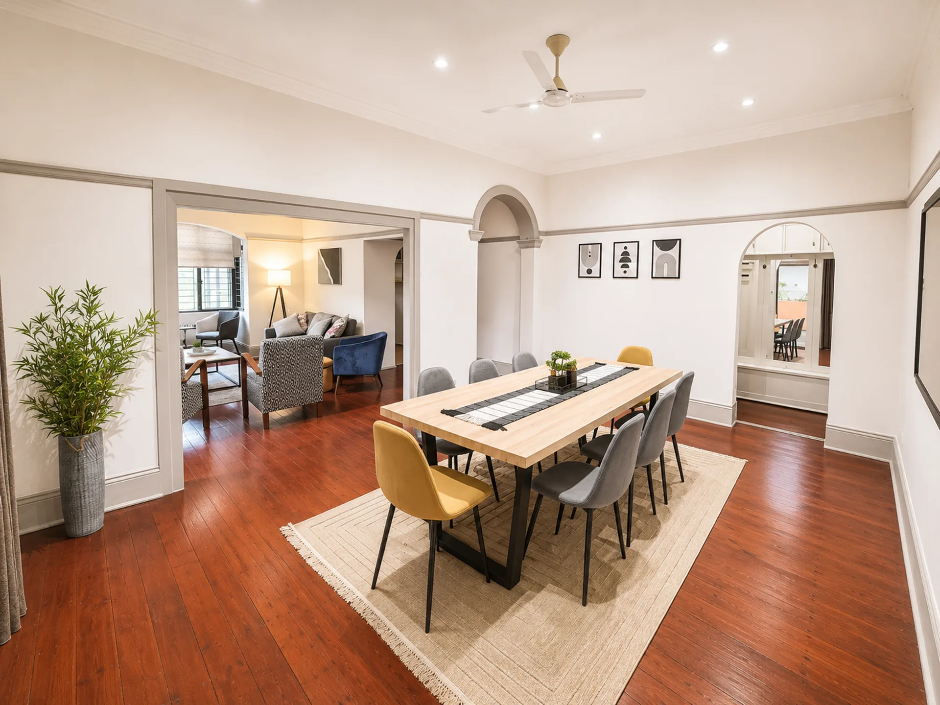 Dining room with light-wood table and archway to the lounge, Musgrave Escape, Durban, managed by EZStay